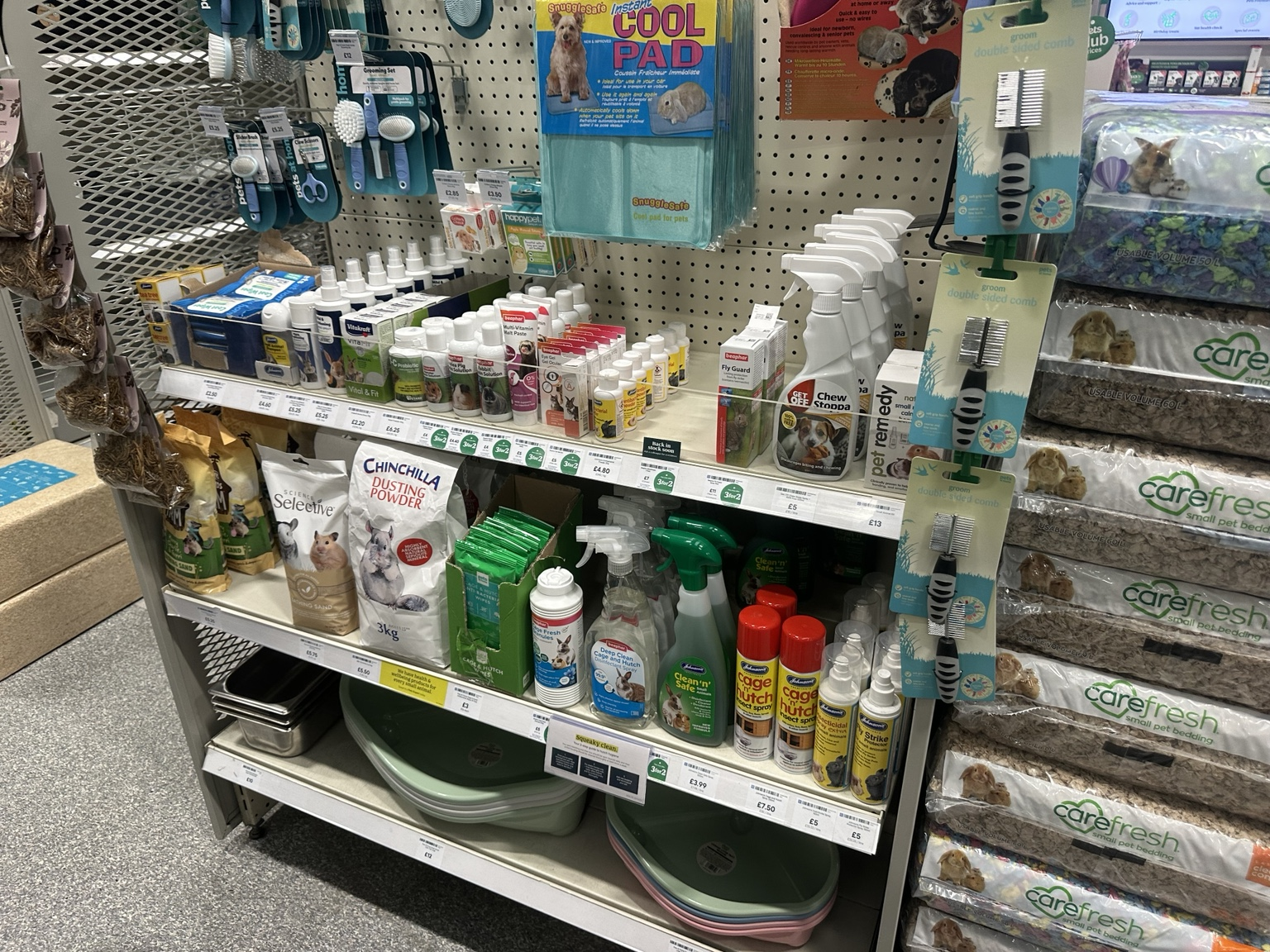 Dog care products and grooming supplies on retail shelves